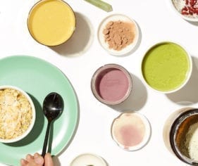 Oats, essential oils, food powders and sauces from Clean Market are placed on a table.